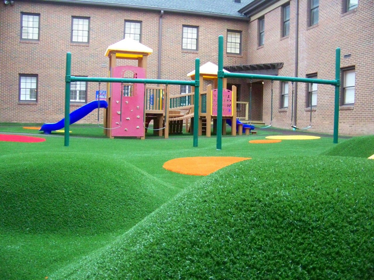 Hilly artificial turf playground by Southwest Greens of Connecticut